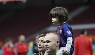 Andres Iniesta of Barcelona celebrates with his wife Anna Ortiz and their childre Paolo Andrea Iniesta Ortiz and Valeria Iniesta Ortiz after Copa del Rey Final soccer match between Sevilla and Barcelona at Wanda Metropolitano Stadium in Madrid, Spain on A