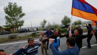 Local residents dance as they wait for arrival of supporters of Armenian opposition leader Nikol Pashinyan on their way to Ijevan, in the town of Abovyan, Armenia April 28, 2018. REUTERS/Gleb Garanich
