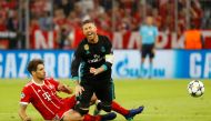 Bayern Munich's Javi Martinez in action with Real Madrid's Sergio Ramos REUTERS/Kai Pfaffenbach
