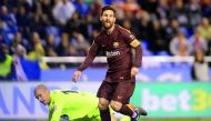 Barcelona's Lionel Messi celebrates scoring their third goal as Deportivo de La Coruna's Ruben looks dejected. Reuters/Miguel Vidal
