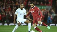 Liverpool's Egyptian midfielder Mohamed Salah (R) controls the ball during the UEFA Champions League first leg semi-final football match between Liverpool and Roma at Anfield stadium in Liverpool, north west England on April 24, 2018. / AFP / Filippo MONT