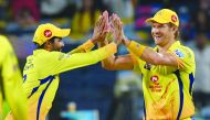 Chennai Super Kings cricketer Ravindra Jadeja congratulates teammate Shane Watson (R) after effecting the run-out of Delhi Daredevils cricketer Shreyas Iyer during the 2018 Indian Premier League (IPL) Twenty20 cricket match between Chennai Super Kings and