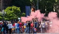 Armenian opposition supporters light a flare as they block a road, after protest movement leader Nikol Pashinyan announced a nationwide campaign of civil disobedience in Yerevan, Armenia. REUTERS/Gleb Garanich