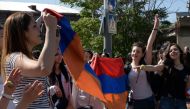 2 converged on the capital, blocking roads and government buildings, as popular anger exploded over the ruling party's rejection of opposition leader Nikol Pashinyan's premiership bid. In an unprecedented show of defiance, protesters paralysed Yerevan, wi