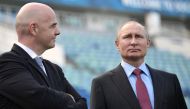  Russian President Vladimir Putin and FIFA president Gianni Infantino visit the Fisht Stadium in the Black Sea resort of Sochi on May 3, 2018. / AFP / SPUTNIK / Alexey NIKOLSKY