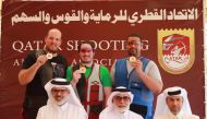 Mohammed Dablan (centre), Angelo Scalzone (left) and Mohamed Al Rumaihi, podium winners at the Qatar Cup Shooting and Archery Championship, pose for a picture along with the Organising Committee Chairman Jaber Al Hajri, Tournament Director Abdullah Al Ham
