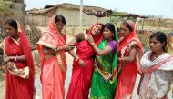 In this photograph taken on May 5, 2018, Indian relatives mourn following the rape and murder of a 16-year-old girl on May 3, at Raja Kundra Village in Chatra district of the eastern Indian state of Jharkhand. AFP
