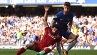 Liverpool's Egyptian midfielder Mohamed Salah (L) vies with Chelsea's English defender Gary Cahill during the English Premier League football match between Chelsea and Liverpool at Stamford Bridge in London on May 6, 2018.  AFP / Glyn Kirk