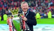 n this file photo taken on May 12, 2013 Manchester United's Scottish manager Alex Ferguson holds the Premier League trophy at the end of the English Premier League football match between Manchester United and Swansea City at Old Trafford in Manchester, no