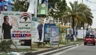Electoral campaign posters are seen on May 8, 2018 in the multi-ethnic city of Kirkuk. Iraqi goes to the poll on May 12. / AFP / Marwan IBRAHIM