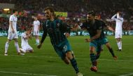 Southampton's Italian striker Manolo Gabbiadini (C) celebrates scoring his team's first goal during the English Premier League football match between Swansea City and Southampton at The Liberty Stadium in Swansea, south Wales on May 8, 2018.  AFP / Geoff 