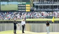 (L-R) Tiger Woods, Phil Mickelson and Rickie Fowler of the United States stand on the 17th green during the second round of THE PLAYERS Championship on the Stadium Course at TPC Sawgrass on May 11, 2018 in Ponte Vedra Beach, Florida. Jamie Squire/Getty Im