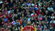 Liverpool's Egyptian midfielder Mohamed Salah celebrates after scoring during the English Premier League football match between Liverpool and Brighton and Hove Albion at Anfield in Liverpool, north west England on May 13, 2018. AFP / Paul Ellis