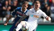 Swansea City's Alfie Mawson with Stoke City's Peter Crouch.  via Reuters/Peter Cziborra