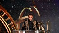 Paris Saint-Germain's Brazilian forward Neymar speaks as he receives the Best Ligue 1 Player award during a TV show on May 13, 2018 in Paris, as part of the 27th edition of the UNFP (French National Professional Football players Union) trophy ceremony. AF
