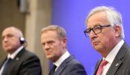 European Commission President Jean-Claude Juncker (R) reacts, next to European Council President Donald Tusk (C) and Bulgarian Prime Minister Boyko Borisov (L), during a joint press conference during an EU-Western Balkans Summit in Sofia on May 17, 2018. 