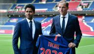 French Ligue 1 football club Paris Saint-Germain's newly appointed coach German Thomas Tuchel (R) poses with club's president Nasser Al-Khelaifi after a press conference to officially present him as the club's new recruit on May 20, 2018 at the Parc des P