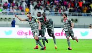 Al Duhail captain Karim Boudiaf (left) along with team-mates celebrates after scoring a goal against Al Rayyan during their Amir Cup final on Saturday. 