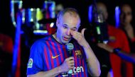 Barcelona's Spanish midfielder Andres Iniesta wipes his tears during a tribute after the Spanish league football match between FC Barcelona and Real Sociedad at the Camp Nou stadium in Barcelona on May 20, 2018.  AFP / Lluis Gene