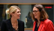 Estonian Minister of Foreign Trade Urve Palo (L) talks with EU Commissioner of Trade Cecilia Malmstrom (R) during a Foreign Affairs Trade Minister's meeting at the EU headquarters in Brussels on May 22, 2018. / AFP / JOHN THYS