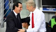 (FILE PHOTO) Unai Emery (L) shakes hands with Arsene Wenger. AFP / FRANCK FIFE 
