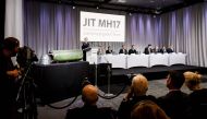 A part of the BUK-TELAR rocket that was fired on the MH17 flight is displayed on a table during the persconference of the Joint Investigation Team (JIT), in Bunnik on May 24, 2018.  AFP / Robin van Lonkhuijsen
