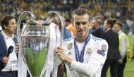Real Madrid's Gareth Bale poses for a photo with the trophy after winning the UEFA Champions League final football match against Liverpool FC at the Olimpiyskiy stadium in Kiev, Ukraine, on May 26, 2018. Vladimir Shtanko - Anadolu Agency