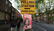 A Pro-Choice poster featuring Savita Halappanavar is placed near a sign for a polling station ahead of a 25th May referendum on abortion law, in Dublin, Ireland May 23, 2018. Reuters/Clodagh Kilcoyne