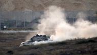 An Israeli army tank patrols along the border between Israel and the Gaza Strip on May 29, 2018. AFP / Jack Guez