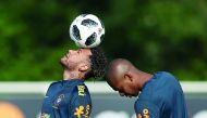 Brazil's striker Neymar (L) takes part in a training session at Tottenham Hotspur's Enfield Training Centre, north-east of London, on May 28, 2018 ahead their International friendly football match against Croatia. / AFP / Daniel Leal-Olivas