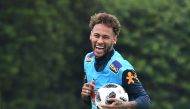 Brazil's striker Neymar laughs during a training session at Tottenham Hotspur's Enfield Training Centre, north-east of London, on May 30, 2018 ahead their international friendly football match against Croatia. / AFP / Ben STANSALL