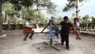 Syrian children displaced from Eastern Ghouta play in a park in Afrin on May 5, 2018.AFP / Nazeer AL-KHATIB

