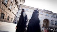 Women in niqab are pictured after the Danish Parliament banned the wearing of face veils in public, at Christiansborg Palace in Copenhagen, Denmark, May 31, 2018. (Ritzau Scanpix/Mads Claus Rasmussen/via REUTERS) 