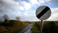 FILE PHOTO: A road which crosses the border from County Donegal in Ireland to County Londonderry in Northern Ireland, is seen from near the border village of Lenamore, Ireland, February 1, 2018. There are no markings apart from the change in roadsigns. RE