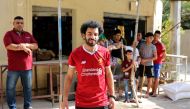 Iraqi footballer Hussein Ali, who plays for the Iraqi Al-Zawraa FC and is a lookalike of Liverpool's Egyptian forward Mohamed Salah, poses for pictures in the capital Baghdad, on June 4, 2018.  AFP / Sabah Arar