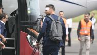 France's forward Olivier Giroud carries his luggage before taking a plane to Russia on June 10, 2018 at the Bron's airport near Lyon, central-eastern France, ahead of the Russia 2018 World Cup. / AFP / PHILIPPE DESMAZES
