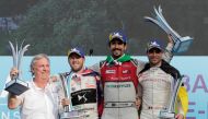 Audi Sport ABT Schaeffler's Lucas Di Grassi celebrates after winning the race with second-placed DS Virgin Racing's Sam Bird and third-placed Dragon's Jerome D'Ambrosio, next to Schaeffler Chief Technology Officer Peter Gutzmer, during the podium ceremony