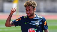 Brazil's striker Neymar greets supporters during a training session at Sochi Municipal Stadium in Sochi on June 12, 2018, ahead of the Russia 2018 World Cup football tournament. AFP / Nelson Almeida