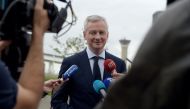 French Finance Minister Bruno Le Maire talks to the press on June 13, 2018 following a press conference at the ADP headquarters in Tremblay-en-France near Roissy airport.  AFP / ERIC PIERMONT
