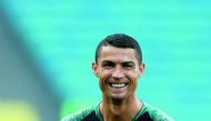 Portugal's forward Cristiano Ronaldo smiles during a training session at the Fisht Olympic Stadium in Sochi on June 14, 2018, on the eve of the Russia 2018 World Cup Group B football match between Portugal and Spain. AFP / Adrian Dennis