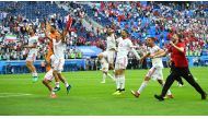 Iran's Reza Ghoochannejhad and team mates celebrate at the end of the match (REUTERS/Dylan Martinez)