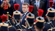 French President Emmanuel Macron reviews a troop of French army soldiers during a ceremony, commemorating General Charles De Gaulle's June 1940 appeal for French resistance against Nazi Germany, at The Mont Valerien National Memorial in Suresnes on the ou