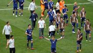 Japan players celebrate after the match, June 19, 2018. REUTERS/Damir Sagolj