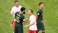 Australia's midfielder Mile Jedinak (2L) shakes hands with Denmark's midfielder Christian Eriksen (2R) after the Russia 2018 World Cup Group C football match between Denmark and Australia at the Samara Arena in Samara on June 21, 2018. (AFP / EMMANUEL DUN