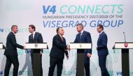 (L-R) Czech Prime Minister Andrej Babis, Austrian Chancellor Sebastian Kurz, Hungarian Prime Minister Viktor Orban, Slovakia's Prime Minister Peter Pellegrini and Polish Prime Minister Mateusz Morawiecki shake hands during a press conference at a meeting 
