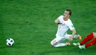 Switzerland's Xherdan Shaqiri in action with Serbia's Luka Milivojevic. Reuters/Fabrizio Bensch