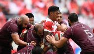 Japan's centre Timothy Lafaele (C) is tackled by Georgian players during the rugby union Test match between Japan and Georgia at Toyota Stadium in Toyota on June 23, 2018. / AFP / Martin BUREAU
