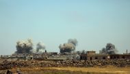 Smoke rises from al-Harak town, as seen from Deraa countryside, Syria June 25, 2018. REUTERS/Alaa al-Faqir