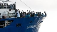 This handout picture obtained on June 22, 2018 from the German NGO Mission Lifeline shows migrants onboard the Lifeline sea rescue boat at sea on June 21, 2018. AFP PHOTO / MISSION LIFELINE