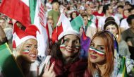 Iranian women watch the World Cup Group B soccer match between Portugal and Iran at Azadi stadium in Tehran on June 25, 2018. / AFP / ATTA KENARE 